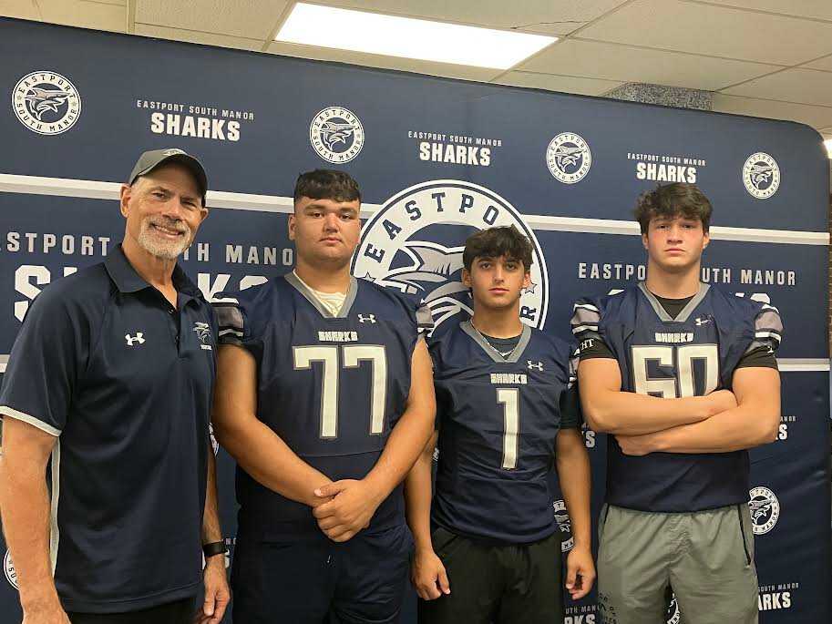 Eastport-South Manor head coach Chris Prokesch and his players are looking to return the program to its winning ways. Left to right: Prokesch and seniors Matt Pompei, Daniel Odell and John Izzo.